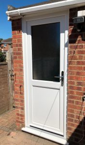 White uPVC entrance door installation